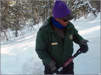 Worker prepares snowpack-sampling pit at Elkhart Park, Wyo.