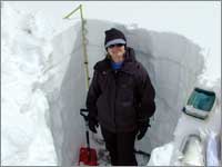 Worker prepares snowpack-sampling pit at Brumley, Colo.