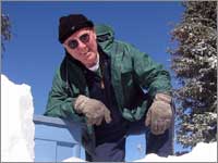 Worker assists in snowpack-sample collection at site near Deadman Pass, Colo.