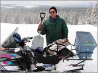 Workers access site at Divide Peak, Wyo. via snowmobile.