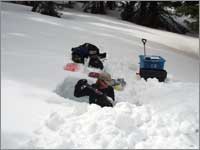 Worker prepares snowpack-sampling pit near Hopewell, N. Mex.