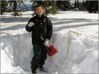 Worker prepares snowpack-sampling pit at Lionshead, Mont.