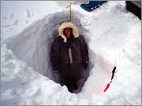 Worker in snowpack-sampling pit at Molas Lake, Colo.