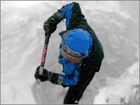 Worker digs snowpack-sampling pit at Rendezvous Mountain, Wyo.