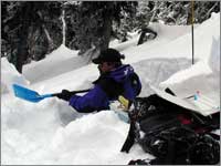 Worker prepares snowpack-sampling pit at Snow Bowl, Mont.