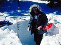Worker prepares snowpack-sampling pit at Twenty-One Mile, Mont., 2