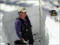 Worker prepares snowpit near University Camp, Colo.